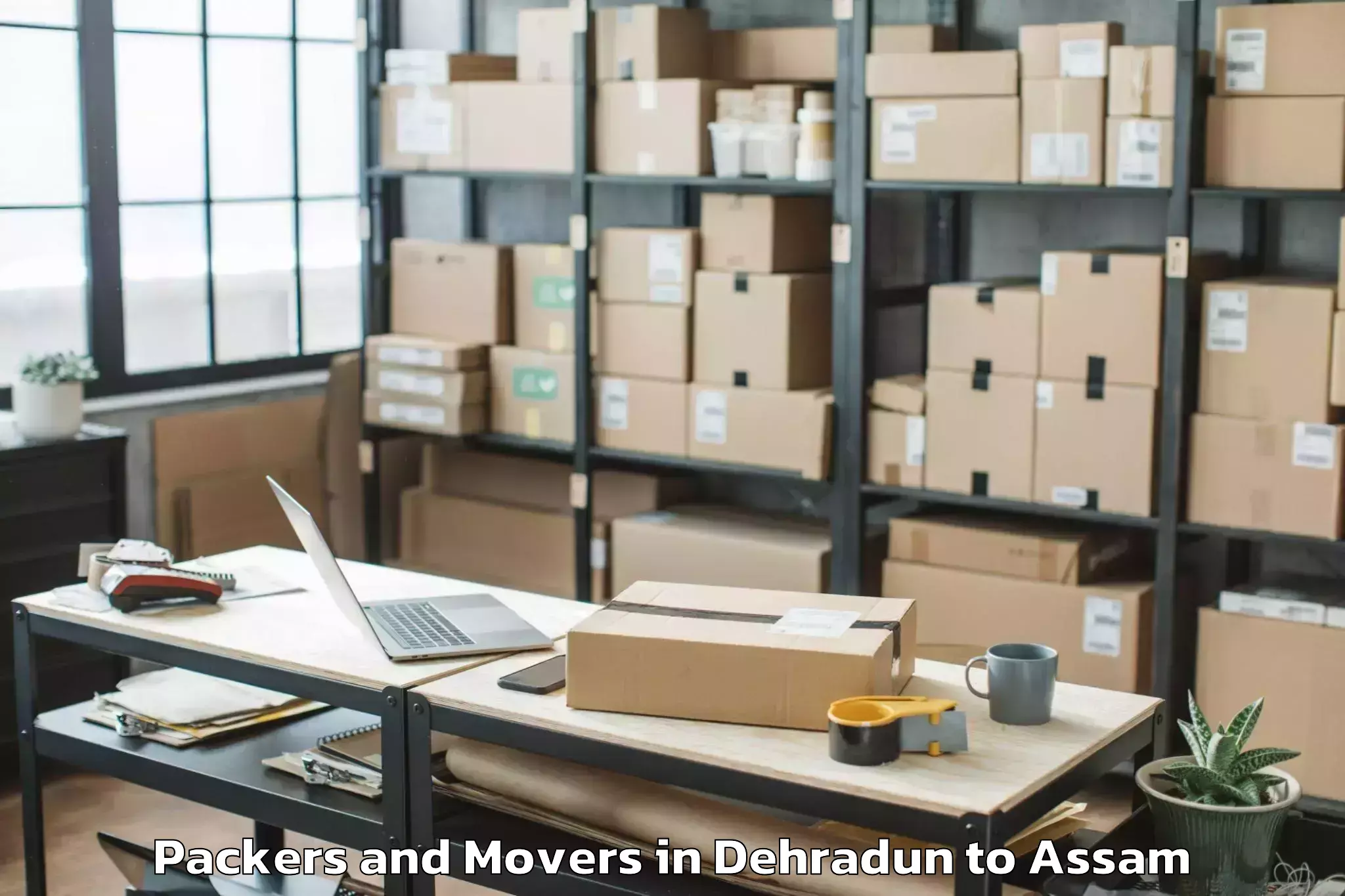 Trusted Dehradun to Dergaon Packers And Movers